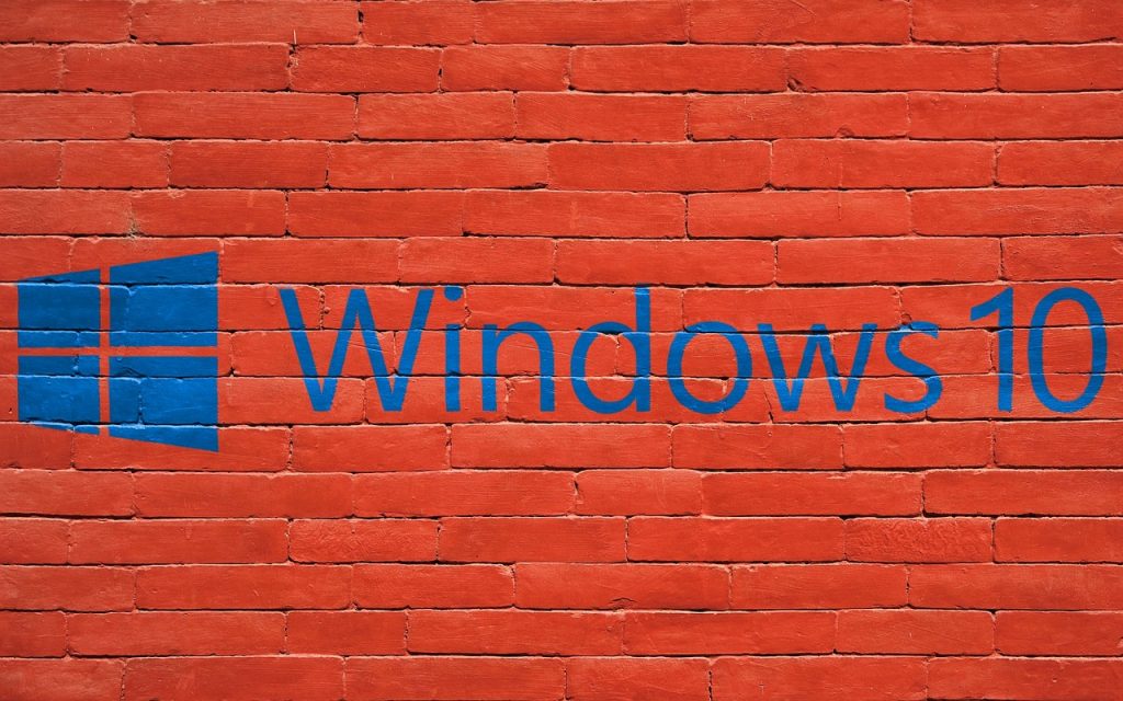 Windows 10 logo painted on red brick wall